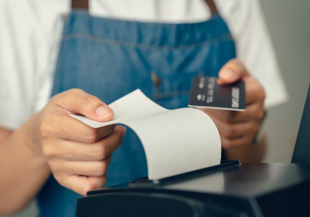 Customer,Holding,Credit,Card,For,Payment,On,Card,Reader,Machine
